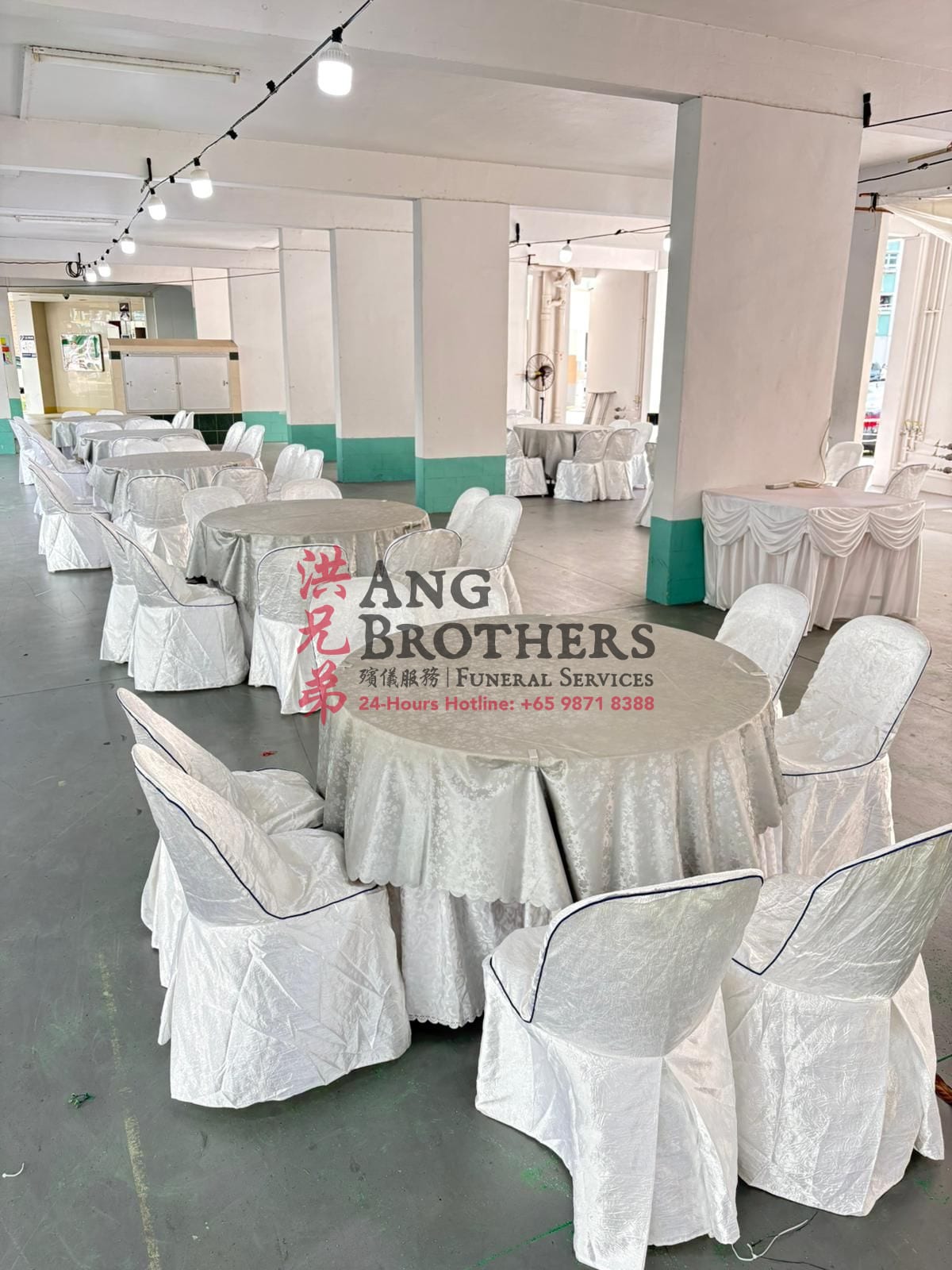 Tables and chairs draped in satin seat covers