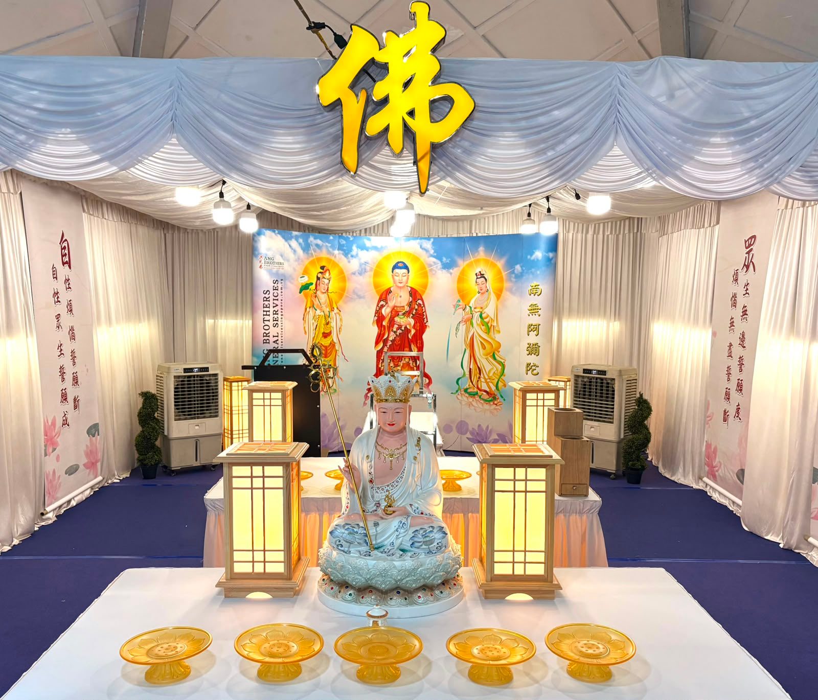 Buddhist altar and backdrop arranged by Ang Brothers