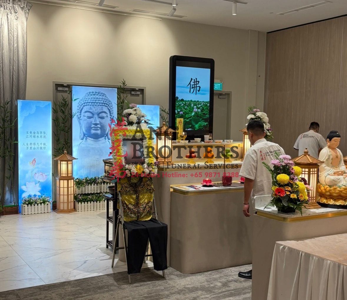 A Buddhist wake setup garlanded in fresh flowers
