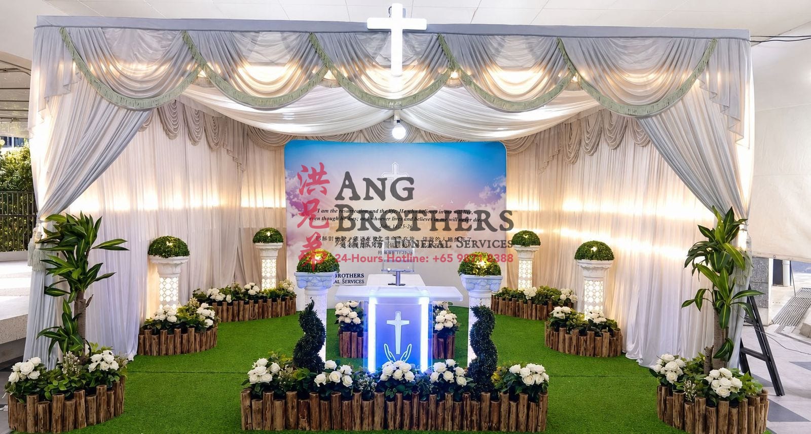 A Christian funeral setup with the cross and an open sky backdrop by Ang Brothers