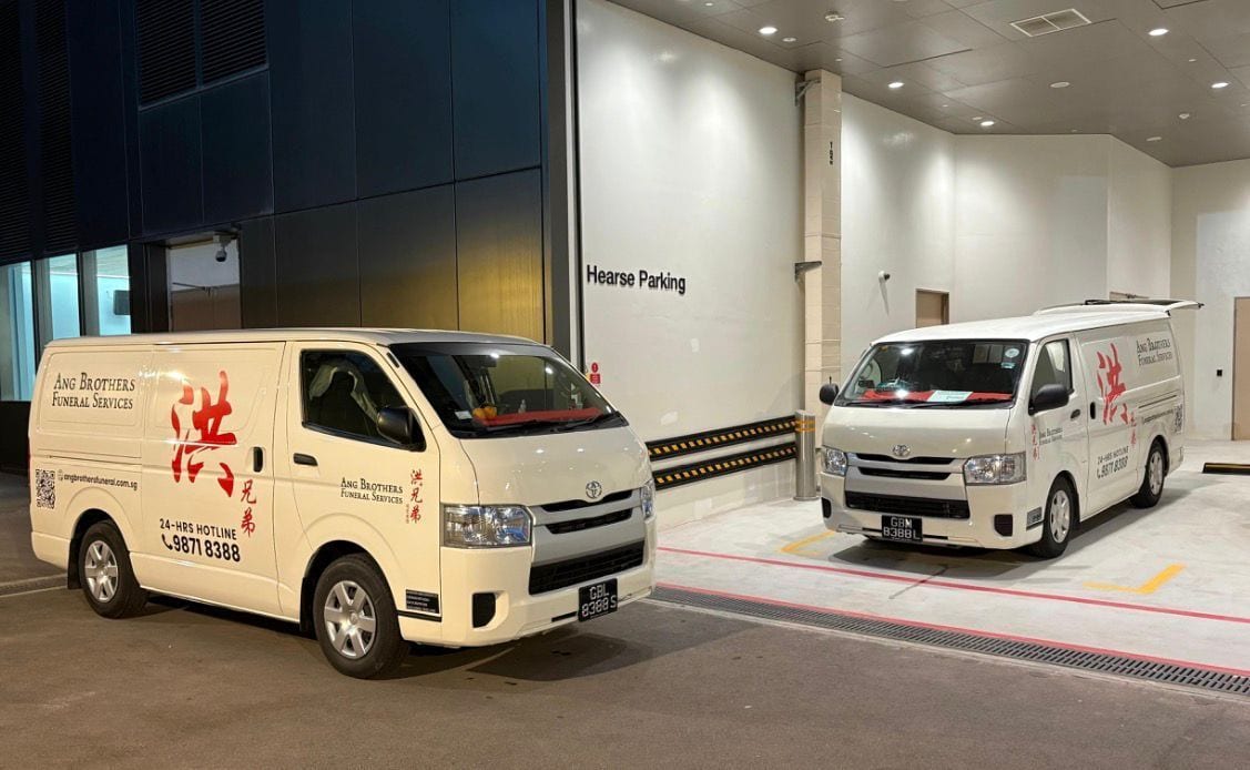 Ang Brothers branded vans at the mortuary for a collection