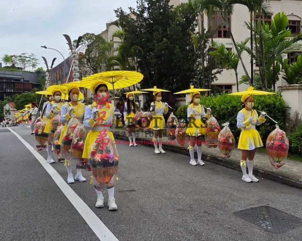 Flower girls leading a grand funeral procession