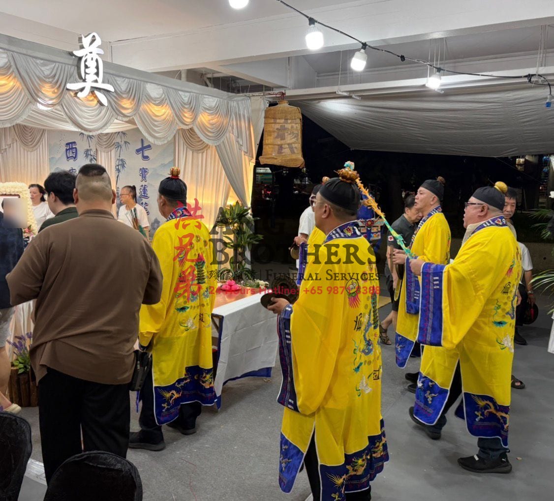 Five Hokkien Taoist priests performing the last night rituals