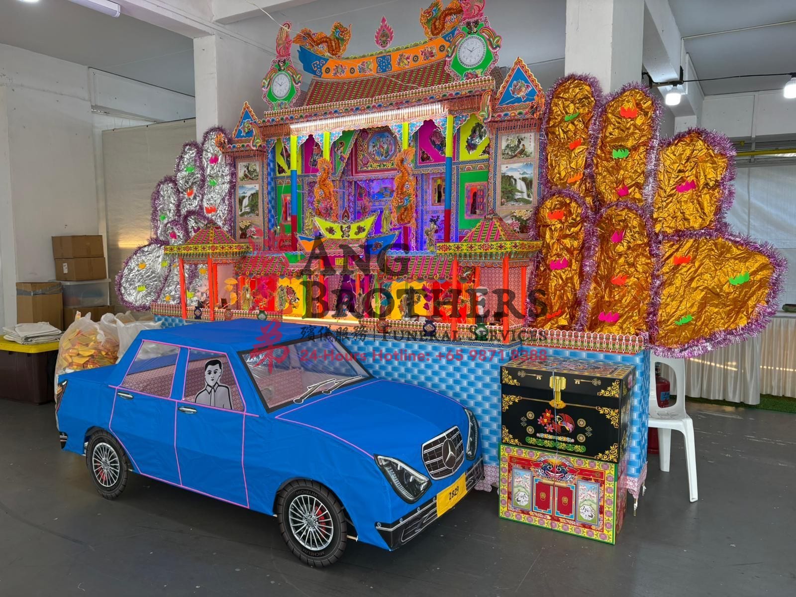 Paper offerings, a paper house and car for the next life