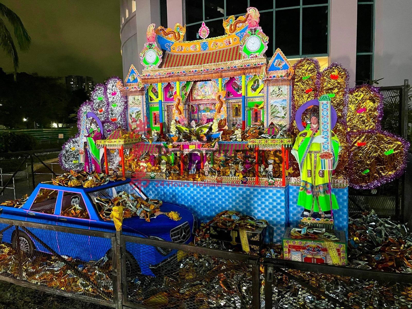 An illuminated paper mansion prepared for a Taoist rite