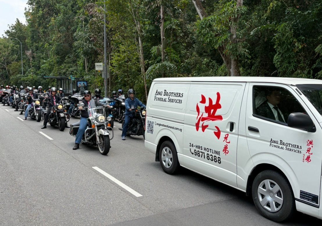 A Harley Davidson escort leading a funeral procession