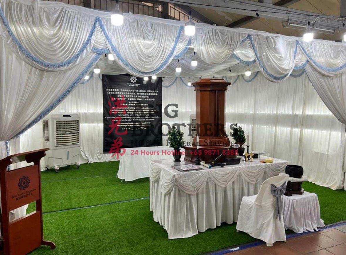 A Soka funeral setup with the Gohonzon by Ang Brothers