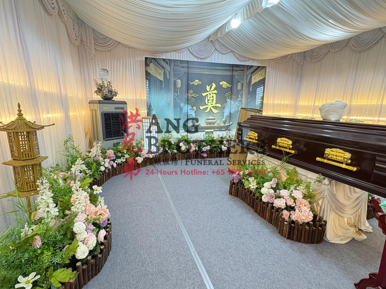 A serene Taoist wake with a polished casket and floral tribute by Ang Brothers